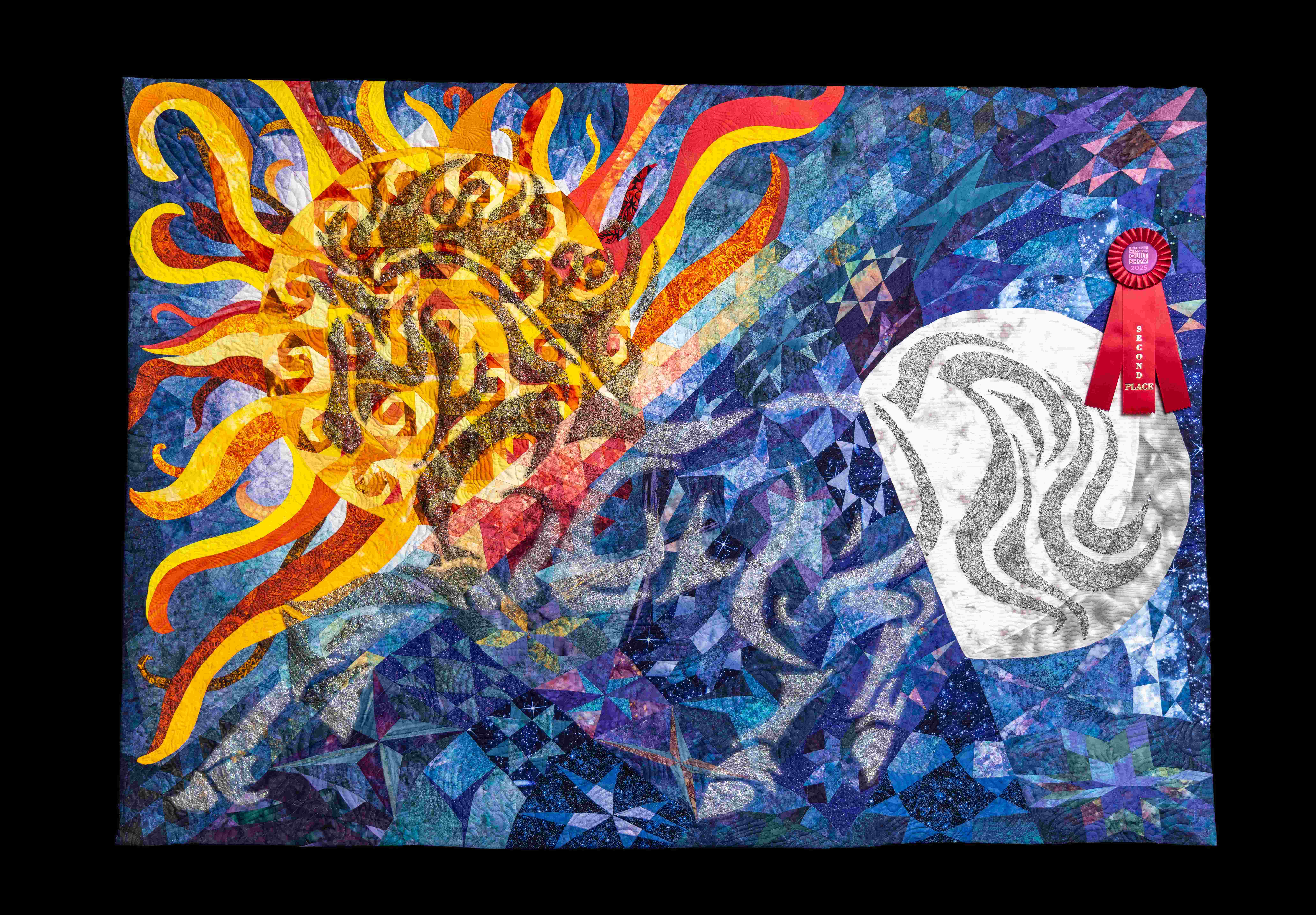 Second-place quilt featuring a radiant sun with swirling rays on a blue gradient, contrasted by abstract white and gray wind-like forms.